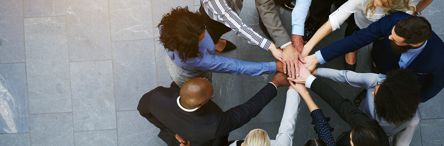 group of people hands joined